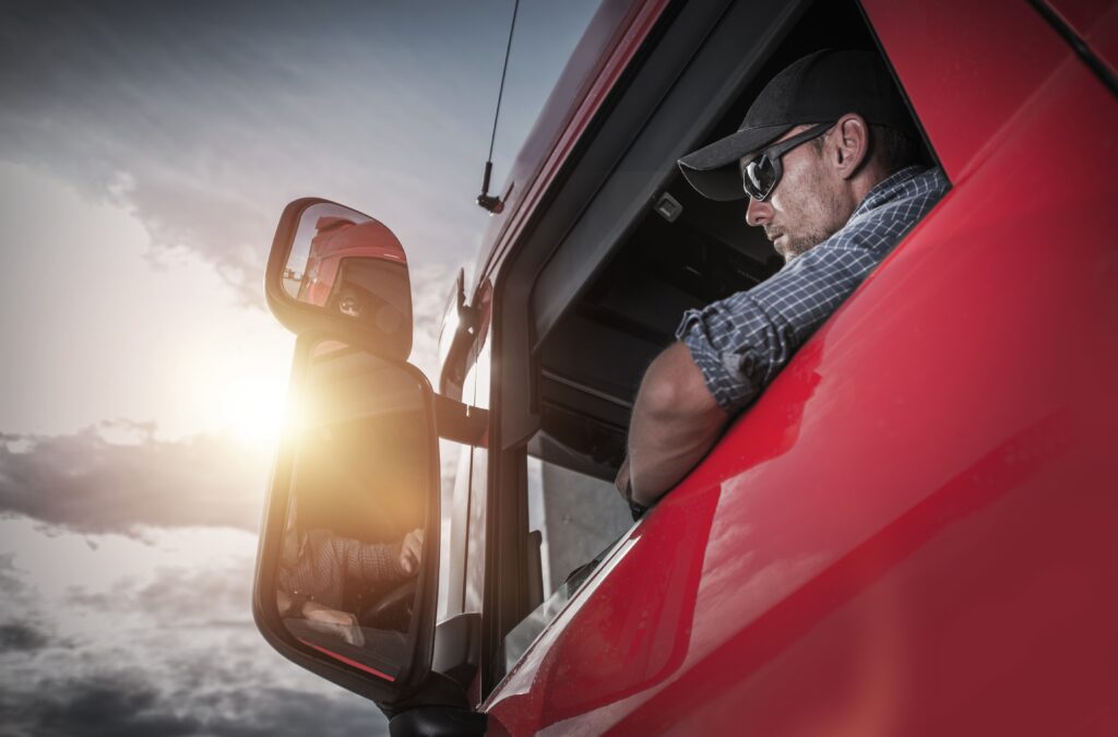 Caucasian Truck Driver Preparing For the Next Destination.